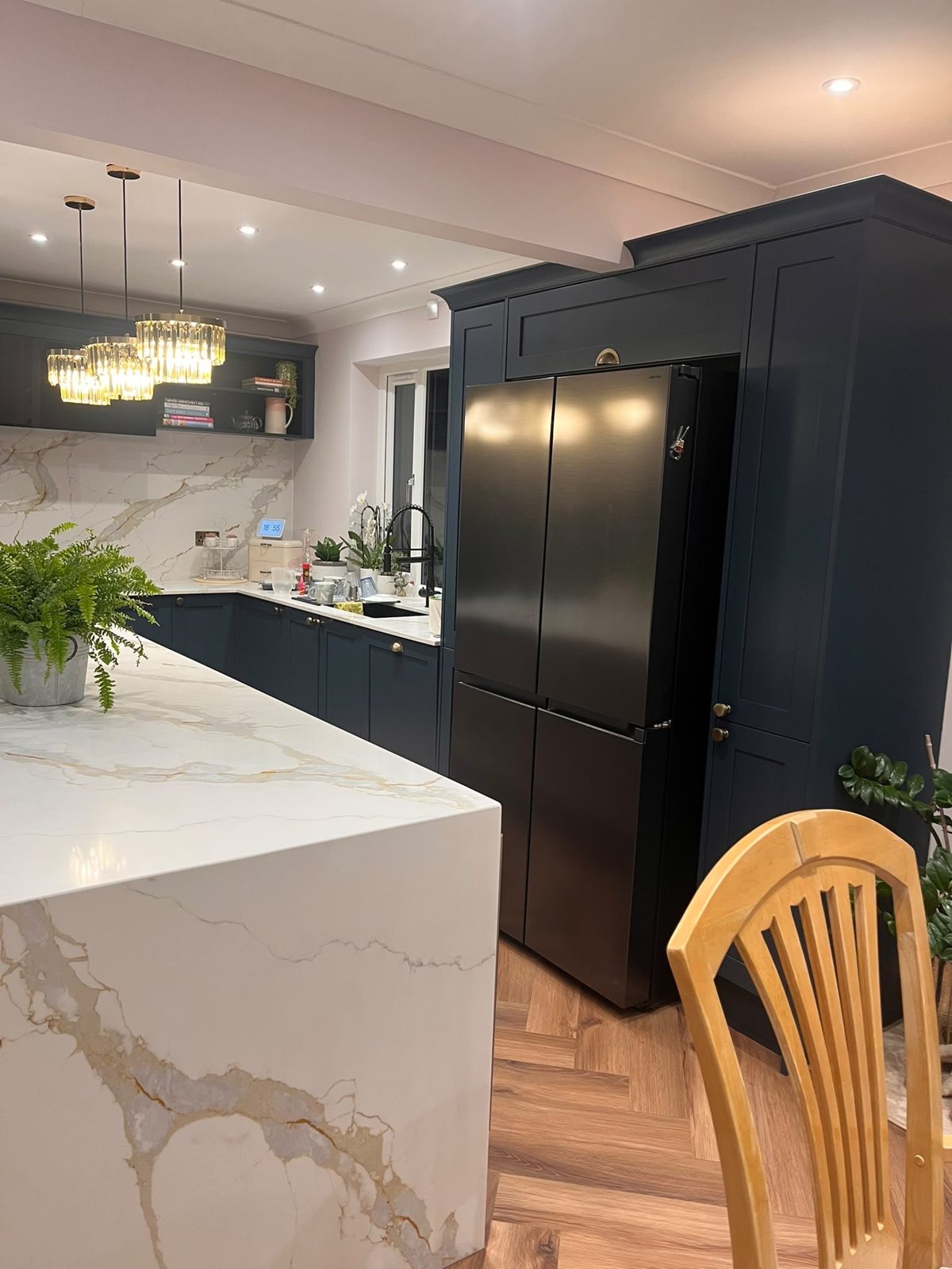Hartforth Blue tall units with cornice around an American fridge freezer