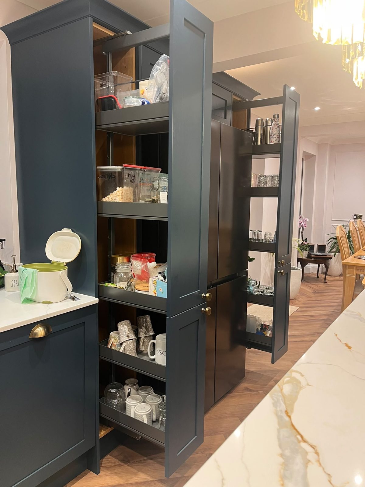 Two pull-out larders opened in Hartforth Blue tall units